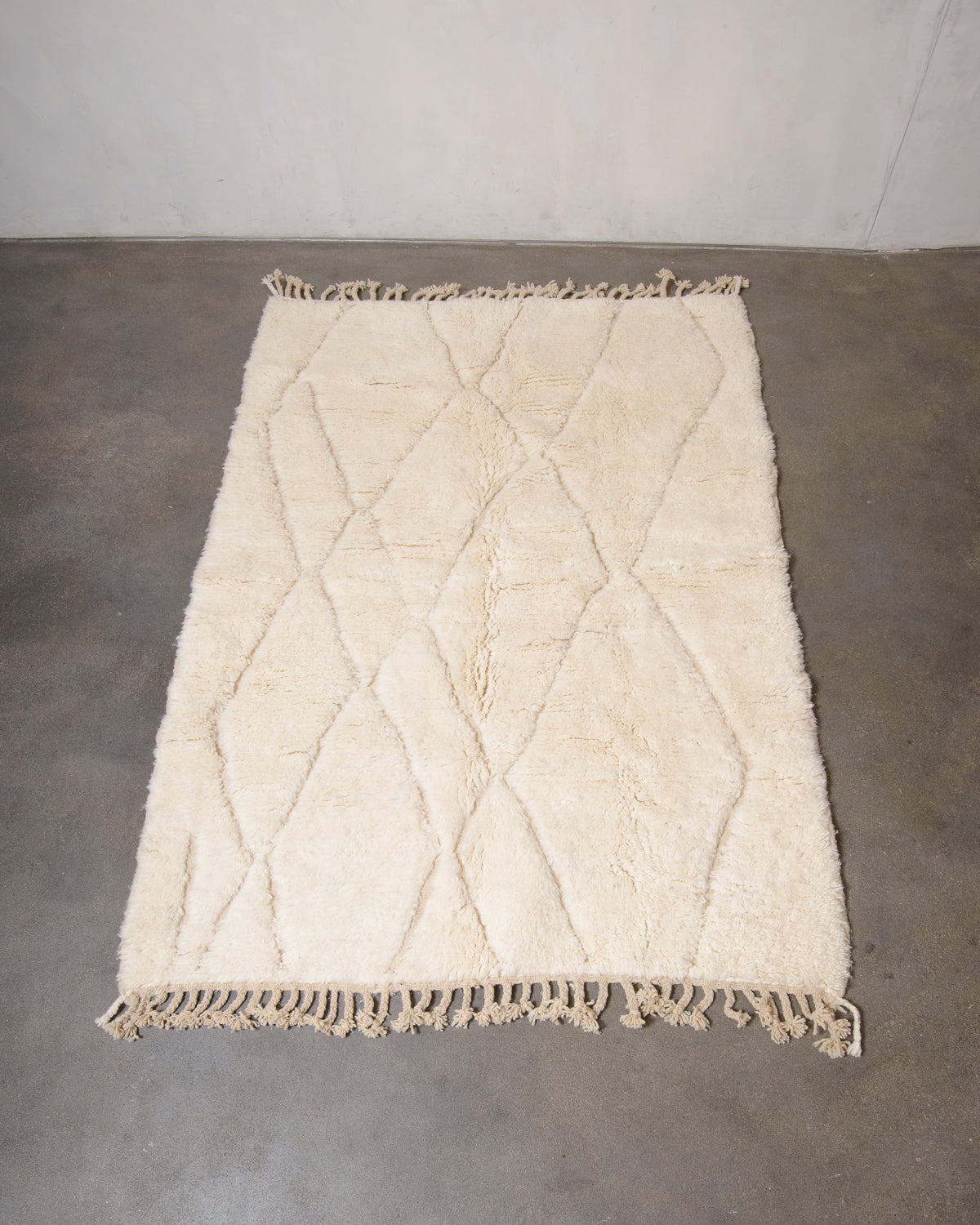 Modern, designer, handcrafted Berber rug from Morocco. Beniourain carpet with minimalist design, natural wool pile and a fluffy texture.